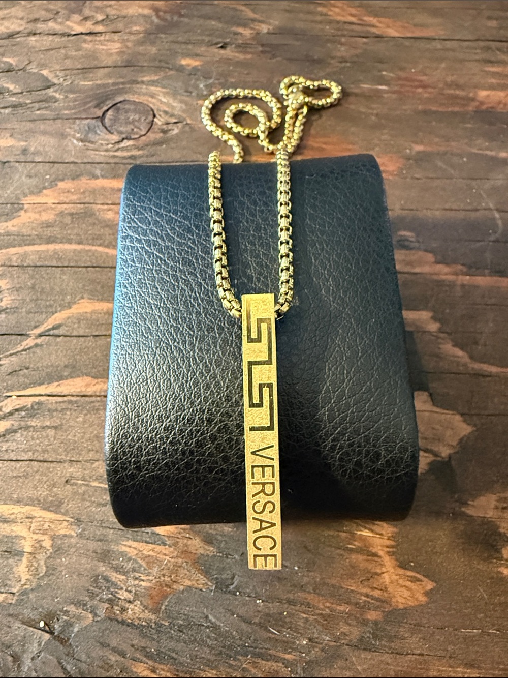 Gold-Tone Greca Vertical Logo Pendant Necklace unisex